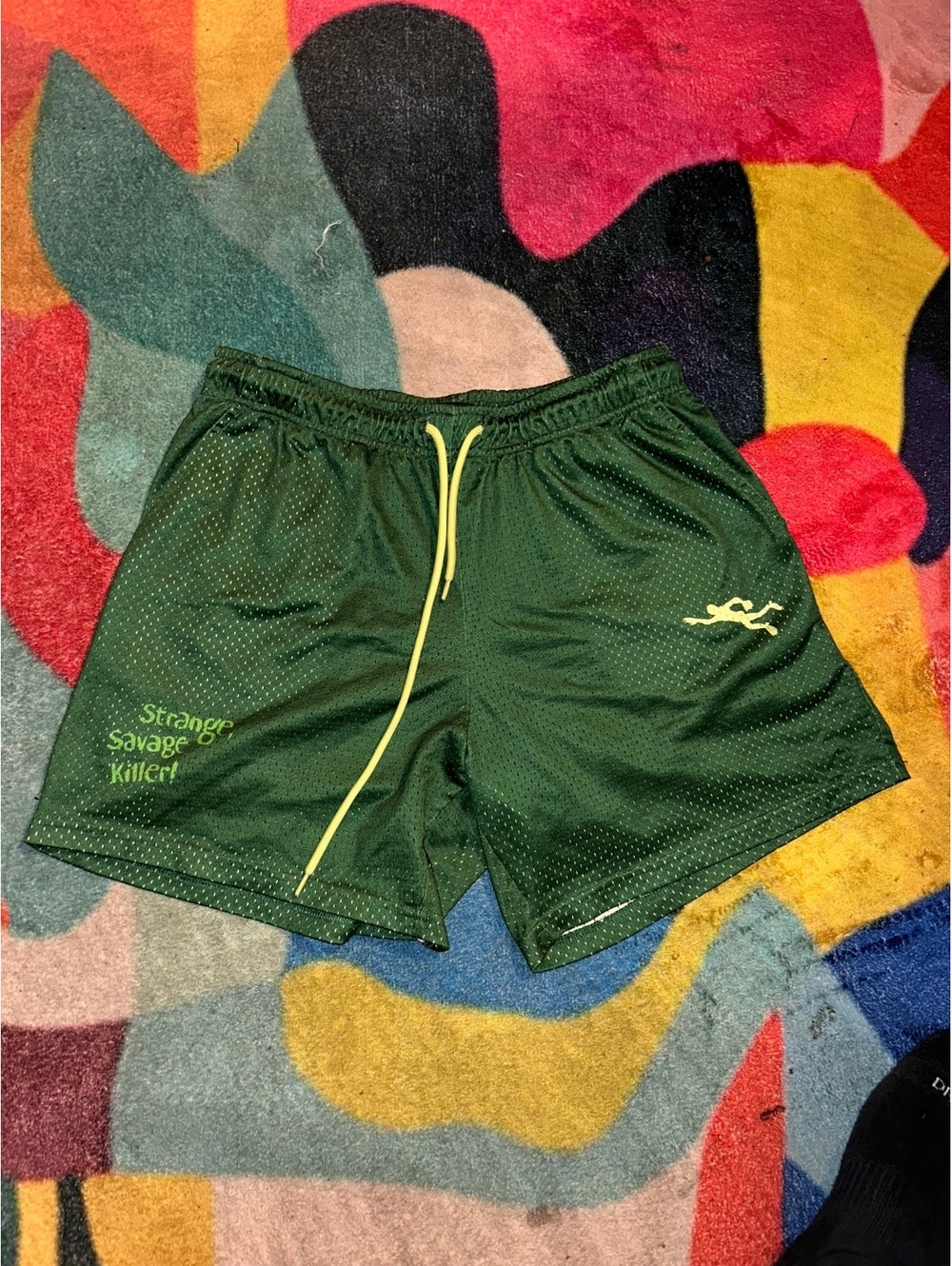 Green Athletic Mesh Shorts with Yellow Drawstring and Graphic Print